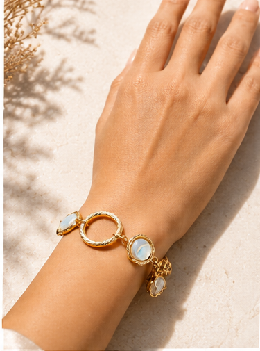 Gold Tone Double Circle Bracelet with Blue Accent - Image 2